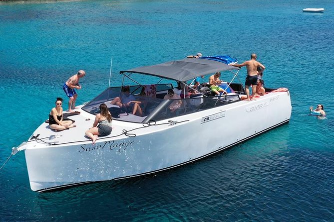 All-inclusive Gastro Blue Cave Tour from Split - The boat ride setup: shaded, stocked, and built for a long day