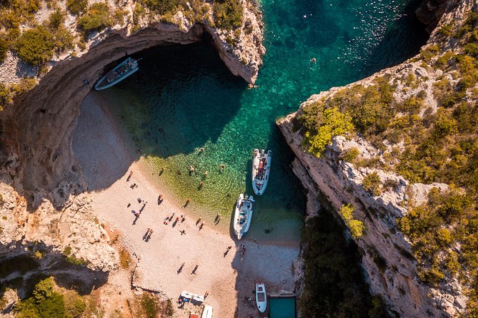 A limestone cove and anchored boats on the Dalmatian coast