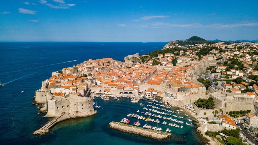 From Split: Dubrovnik Guided Day Trip - Walking the walls toward Srd Mountain: the views are worth it, but plan for stairs