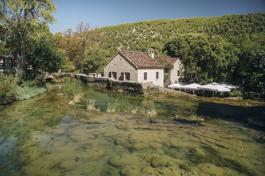 From Split: Krka Waterfalls Tour with Boat Cruise & Swimming - Panoramic boat ride to Skradin: the scenery shift you need