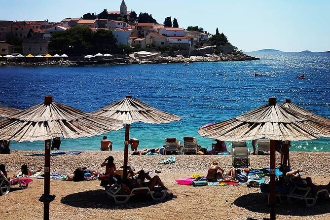 From Split or Trogir: Krka Waterfalls & Primošten Sightseeing - Primošten’s two hours: beach time, church views, and easy relaxation