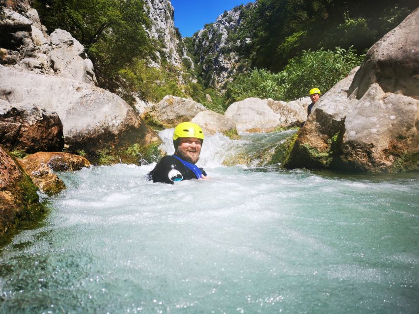 From Split or Zadvarje: Cetina River Canyoning - The canyon route: walking, swimming, and sliding through 200 meters of river drama