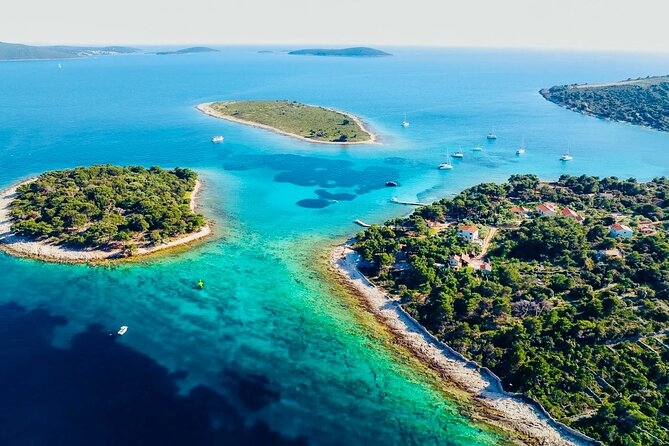 Private Half-Day Boat Tour from Split: Blue Lagoon & 2 Islands - Cruising past Trogir’s UNESCO shoreline before the swimming