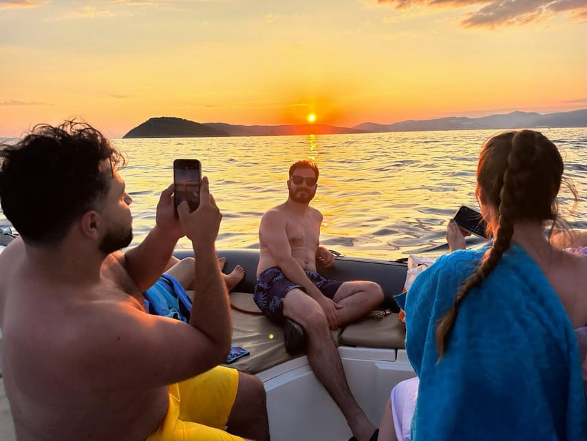Private Sunset Boat Tour with Music and Wine - Practical tips: swimsuits, sunscreen, and avoiding seasickness