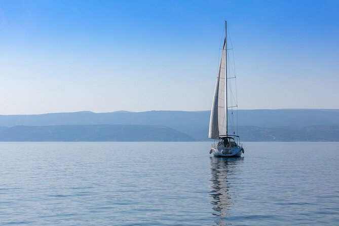 Spend an unforgettable day sailing through the stunning Brač archipelago - Lovrečina Bay: swimming, snorkeling gear use, and paddle boarding