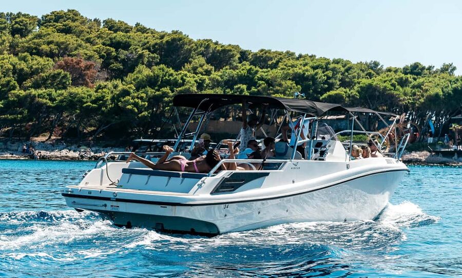Split: Blue Cave, Hvar, and 5 Islands Boat Tour - Komiža photo stop, quick swim time, and a breather from the boat