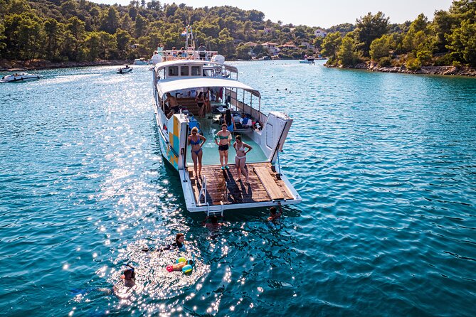 Split: Blue Lagoon, 3 Island Boat Tour & Mediterranean Lunch - Stop 2: Blue Lagoon (Krknjaši Bay) swimming, snorkeling, and the waterslide
