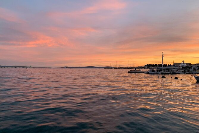 Sunset Tour from Split with Wine Included - Dolphins and music on board: what might happen